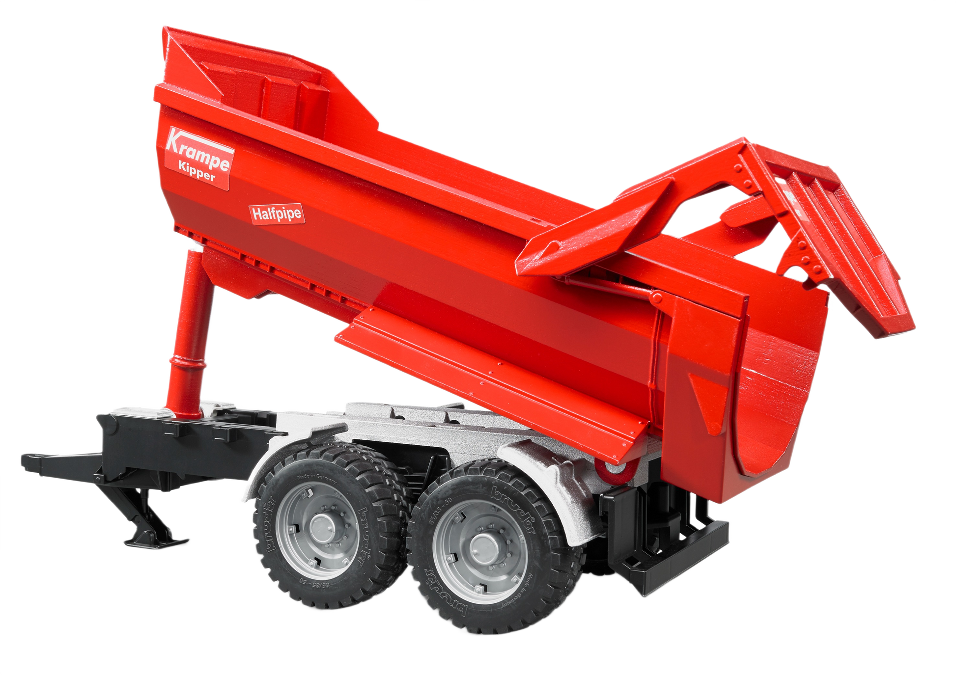 Red tandem axle halfpipe tipping trailer model with detailed wheels and black chassis for realistic play or display