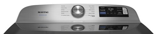 Top load washer control panel with cycle selector, digital display, and stainless steel finish in modern appliance setting