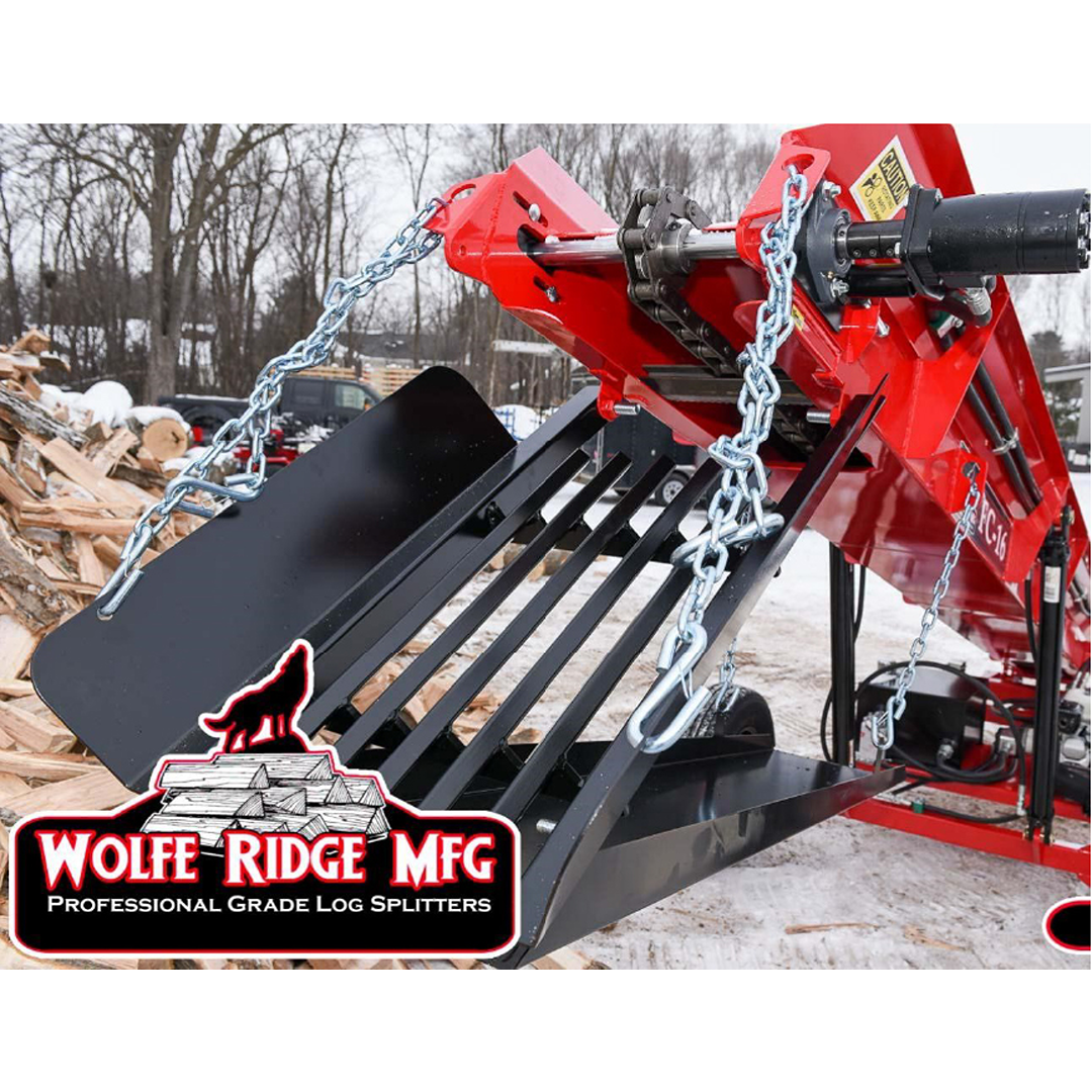 Close-up of red firewood conveyor with heavy chains and metal grate, surrounded by stacked logs outdoors in winter