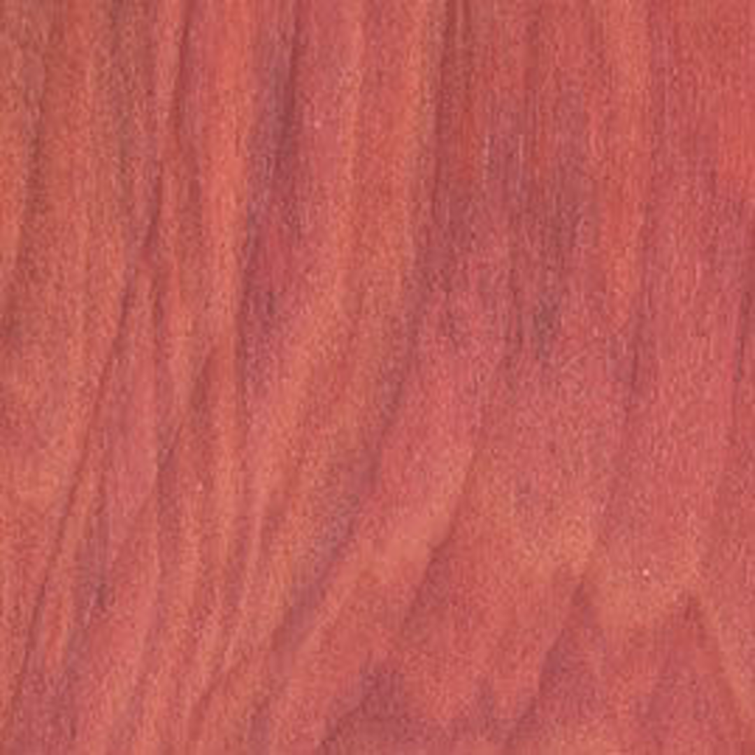 Close-up view of smooth red heart exotic lumber grain for tools and home improvement projects