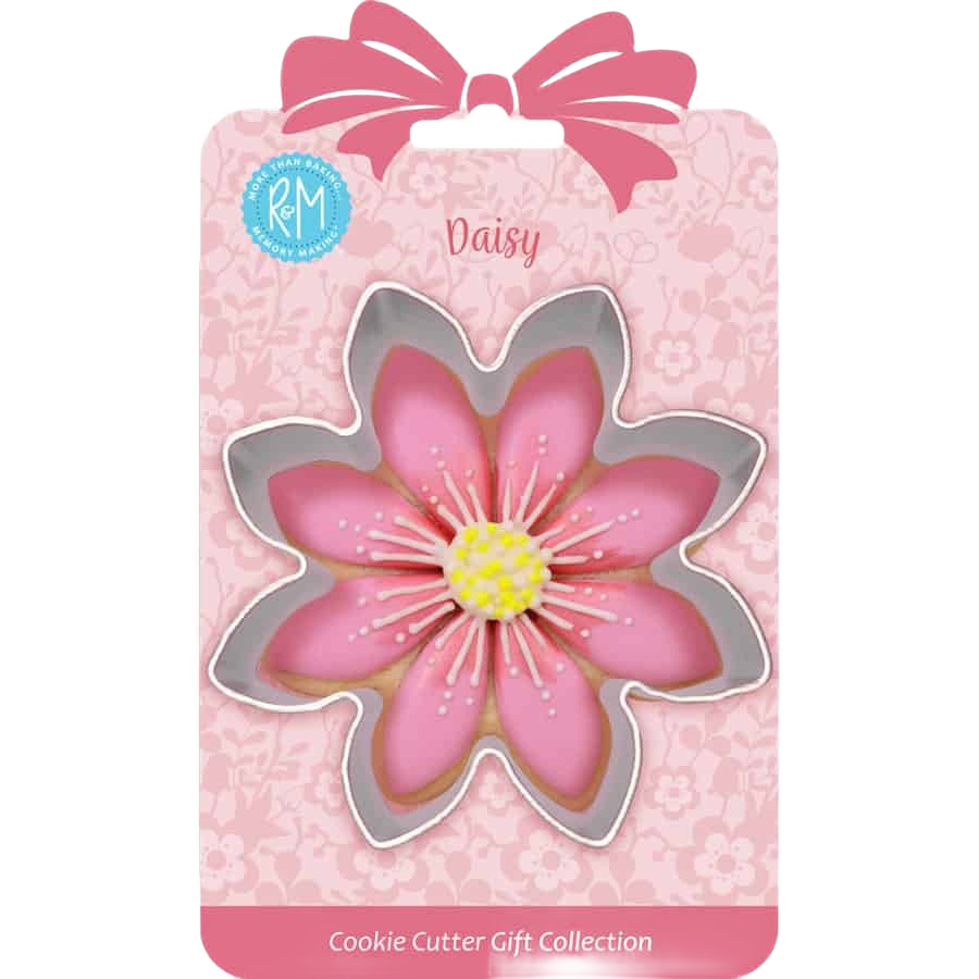 Daisy-shaped metal cookie cutter with scalloped edges for baking and crafting, part of a gift collection