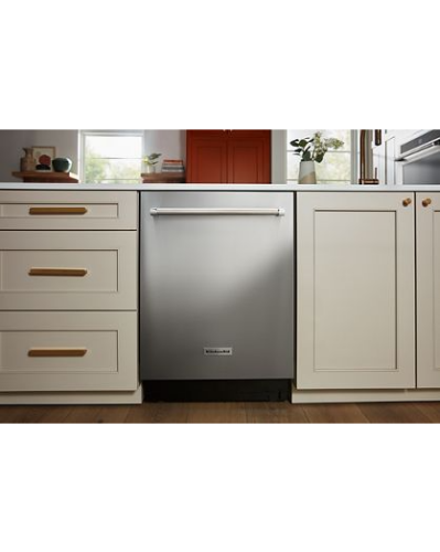 Flush-to-cabinet stainless steel dishwasher with horizontal handle in modern kitchen setting from KitchenAid appliances collection
