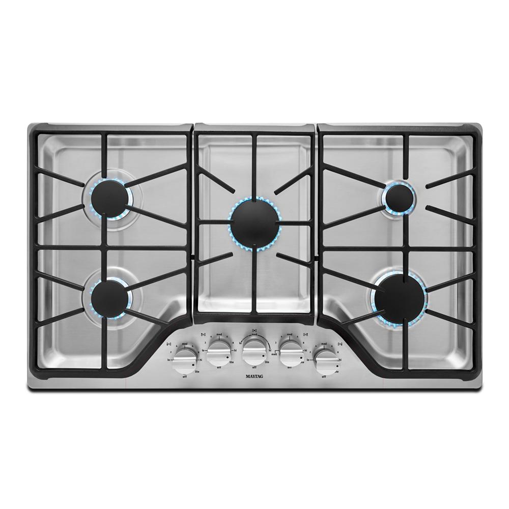 Stainless steel gas cooktop with five burners and control knobs, part of kitchenware and home improvement appliances collection