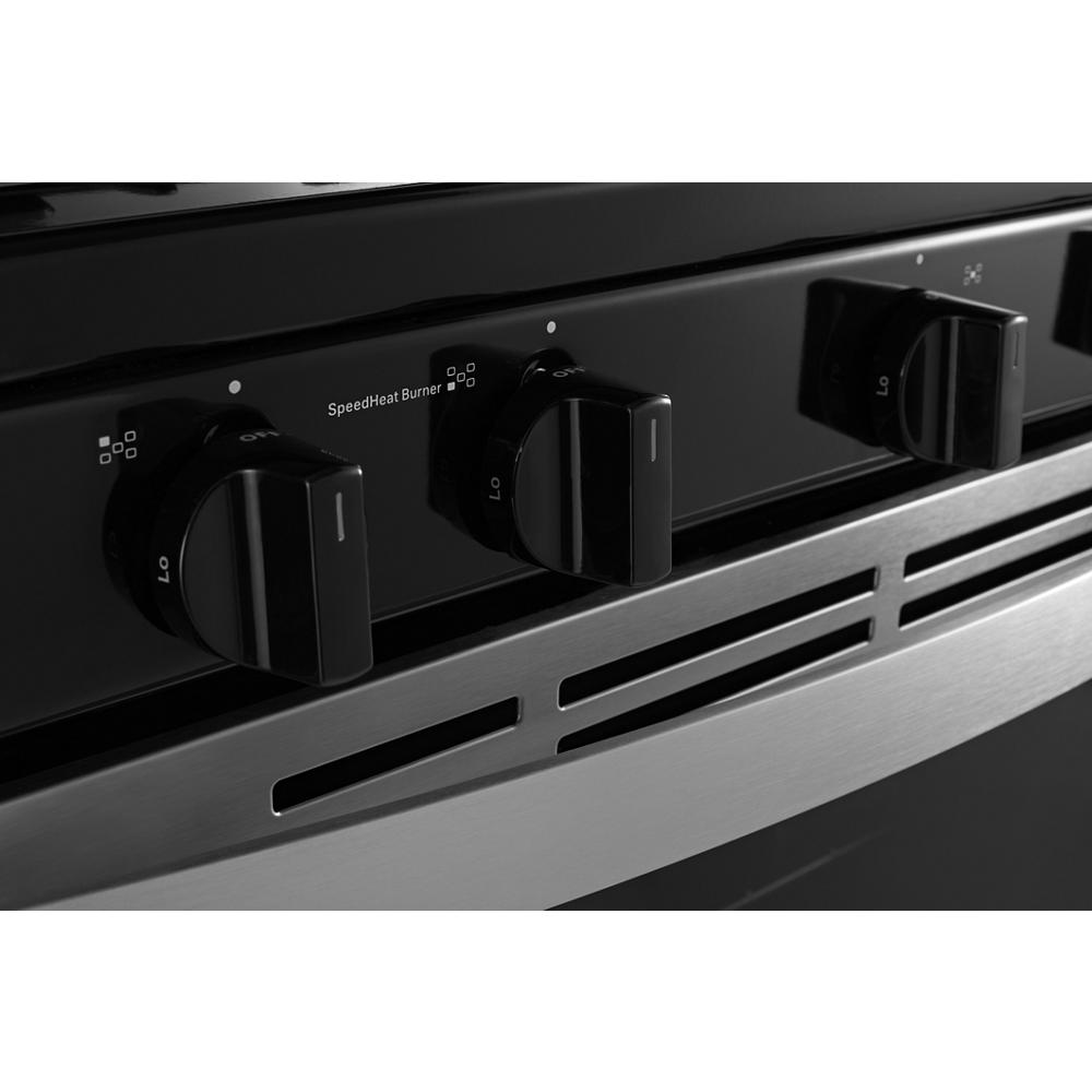 Close-up of black control knobs on a freestanding gas range with stainless steel trim from Ranges & Kitchenware collections