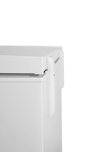Close-up of white chest freezer corner with integrated handle in home appliances and kitchenware setting