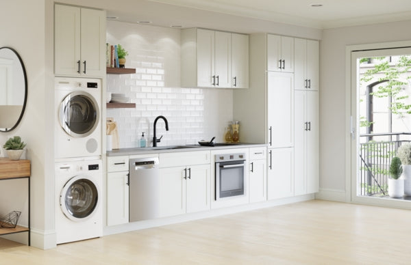 Modern bright kitchen with white cabinetry, stainless steel appliances, and built-in washer and dryer in Kitchen & Kitchenware collection