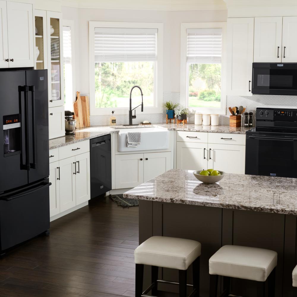 Modern kitchen featuring white cabinetry and a black dishwasher integrated within Kitchen & Kitchenware and Appliances collections