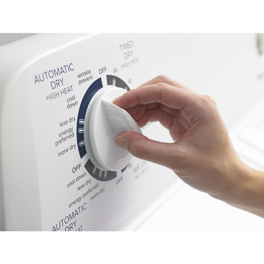 Hand adjusting white control dial on top load electric dryer from home improvement appliances collection