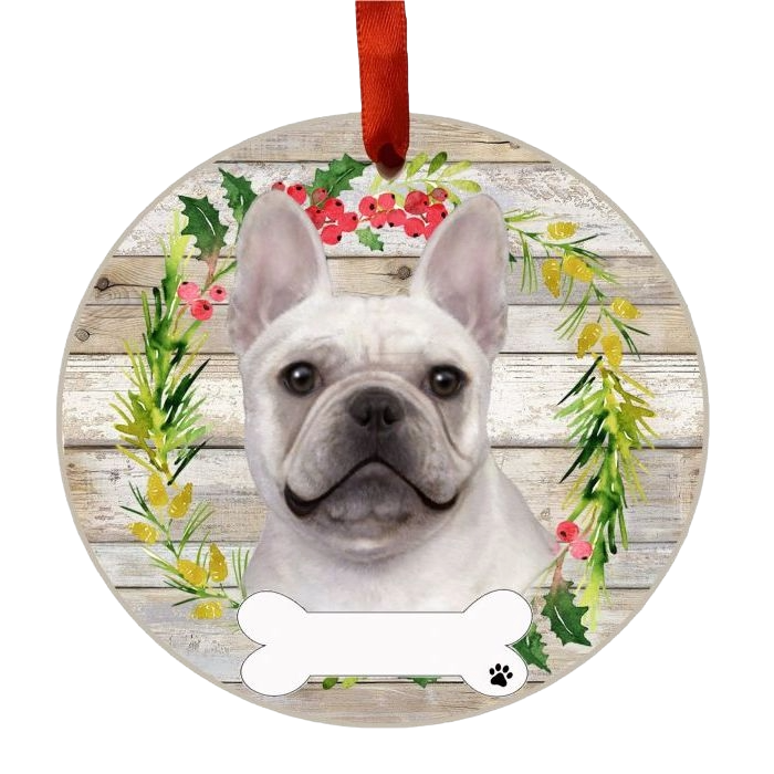 Round wooden Christmas ornament featuring a French Bulldog face inside a festive green and red wreath with a red hanging ribbon