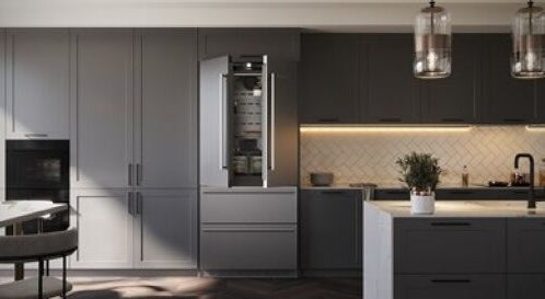 Modern kitchen featuring a freestanding stainless steel French door refrigerator with integrated ice maker in appliances collection