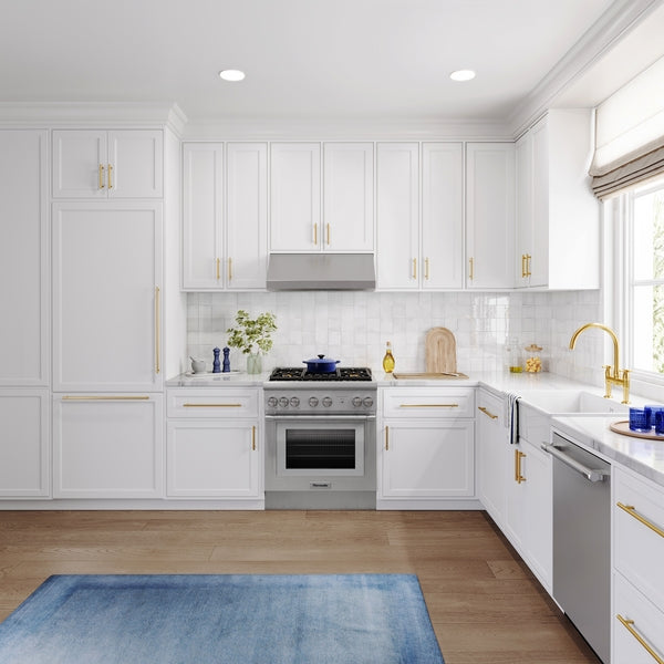 Built-in bottom freezer refrigerator with panel-ready design integrated into white kitchen cabinetry in Thermador Appliances collection