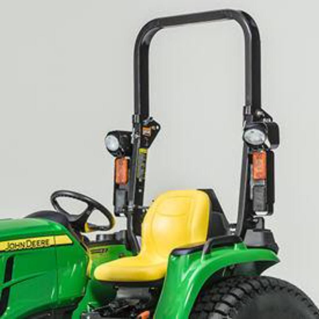 Green utility tractor with yellow seat, rollover protection, and rear lights for outdoor and home improvement use