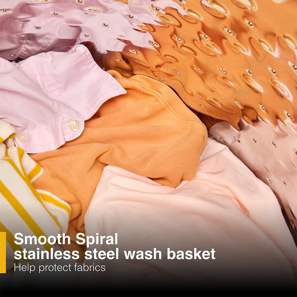 Close-up of soft fabrics submerged in water inside a smooth spiral stainless steel wash basket for top load washers and appliances