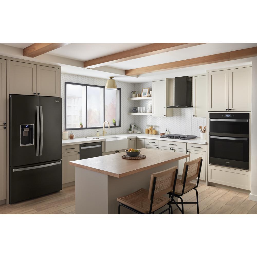Modern kitchen featuring built-in double wall oven microwave combo with air fry and black stainless steel refrigerator