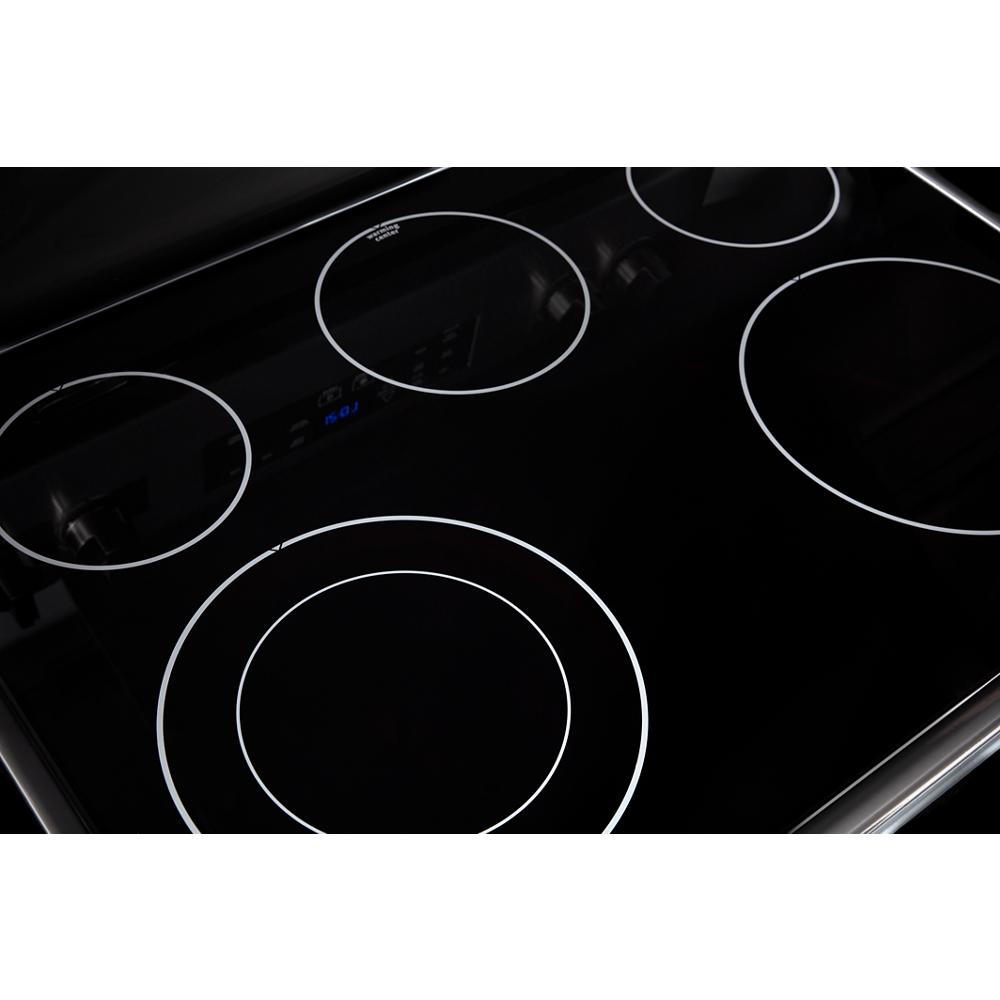 Smooth black electric cooktop with four radiant heating elements for kitchen and home improvement use