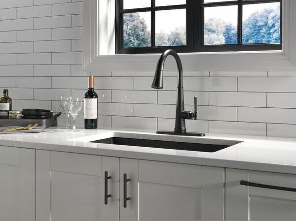 Matte black pull-down kitchen faucet with single handle and modern design in kitchen sink faucet collections