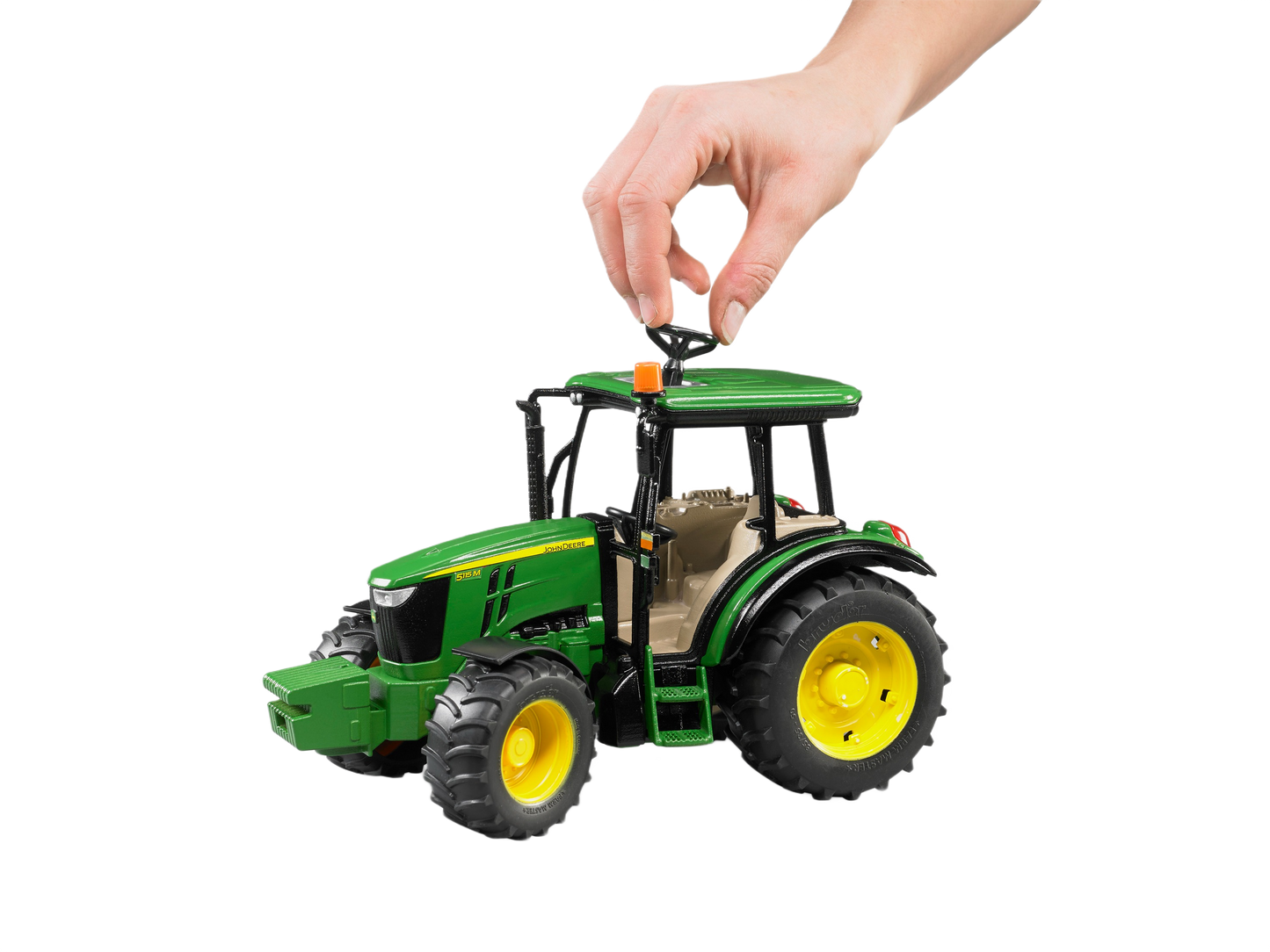 Green and yellow Bruder John Deere 5115 M tractor model with detailed cabin and realistic large tires for display or play