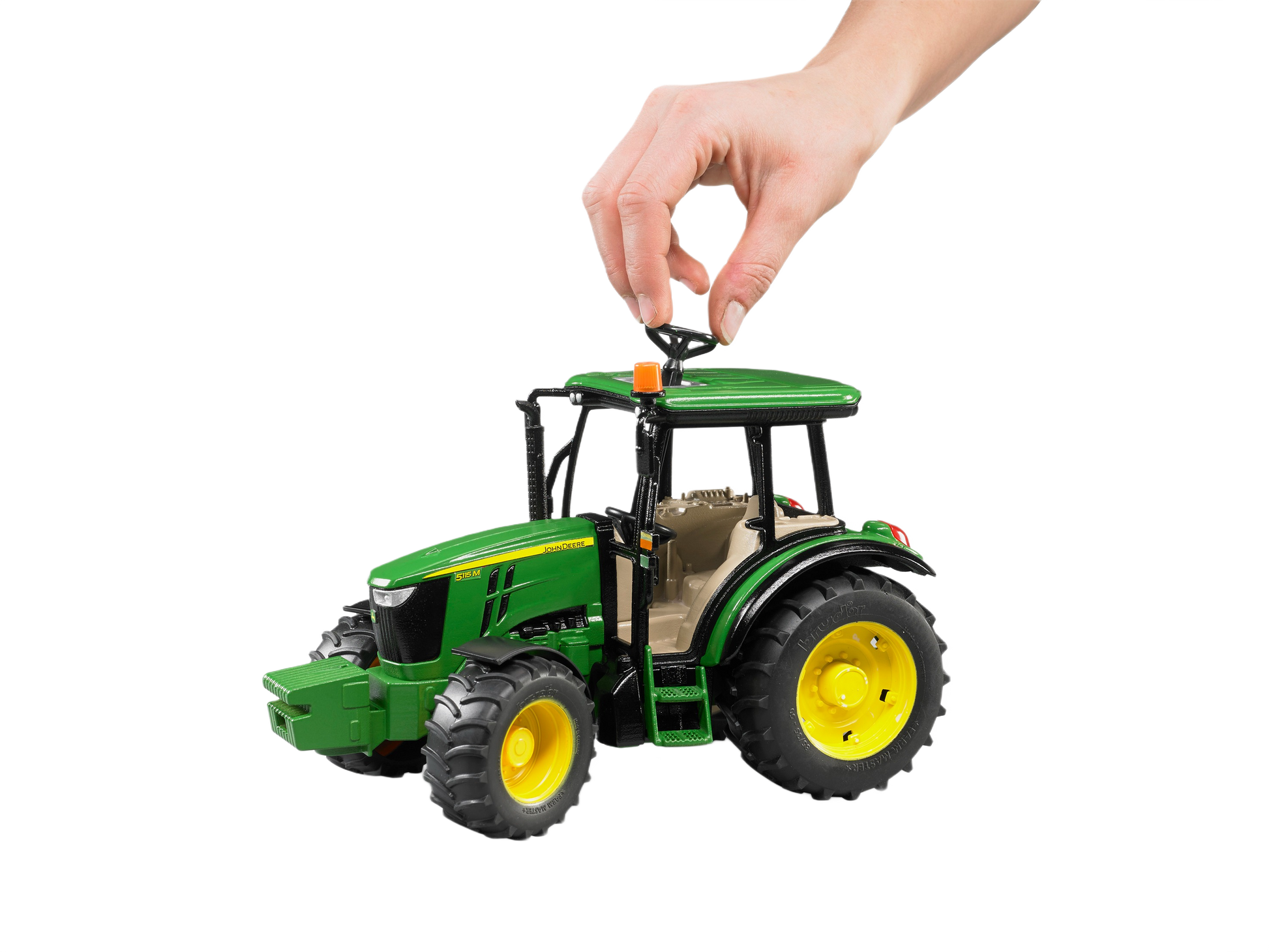 Green and yellow Bruder John Deere 5115 M tractor model with detailed cabin and realistic large tires for display or play