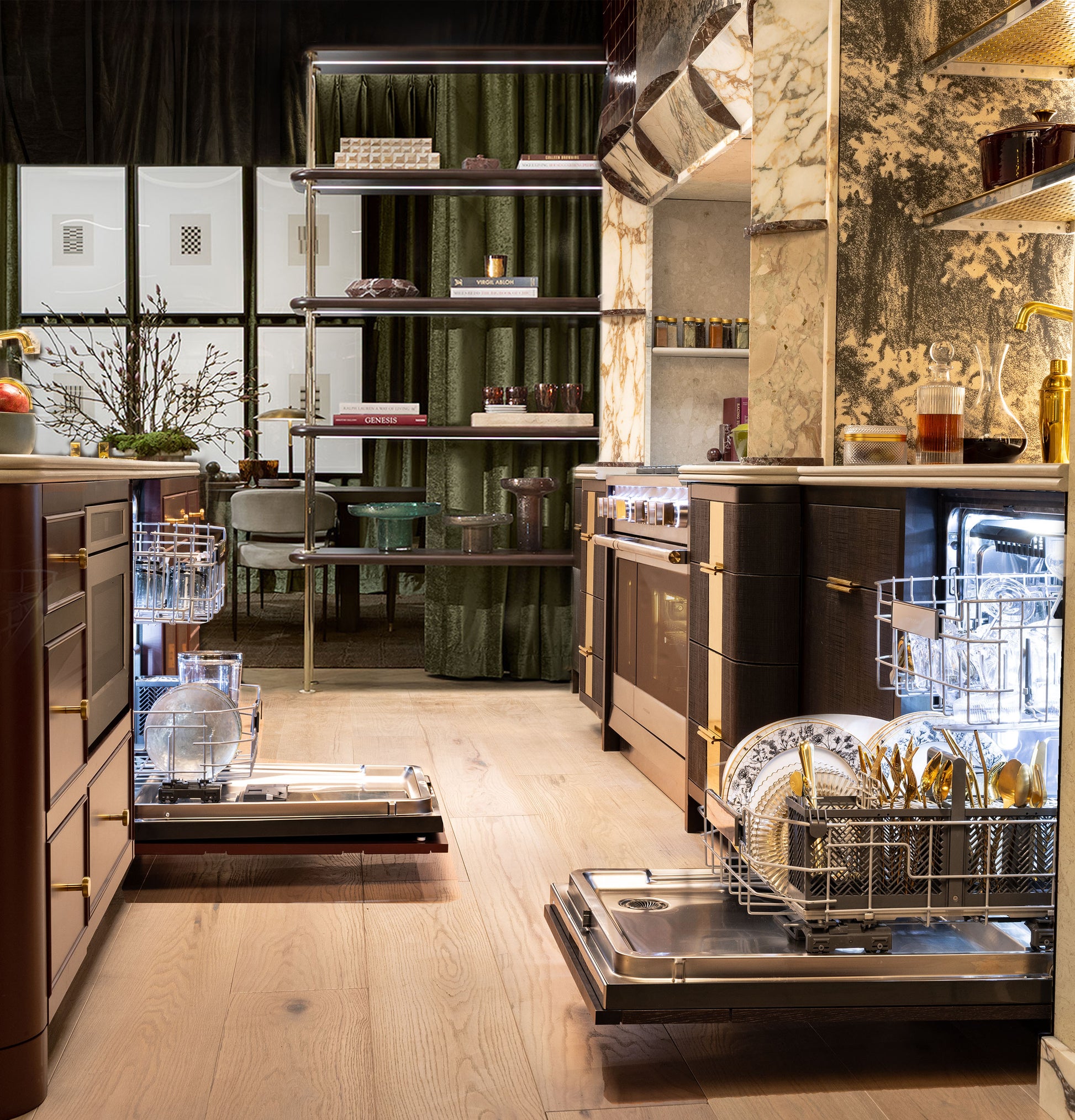 Luxury kitchen featuring two open fully integrated dishwashers with panel ready fronts and dark cabinetry