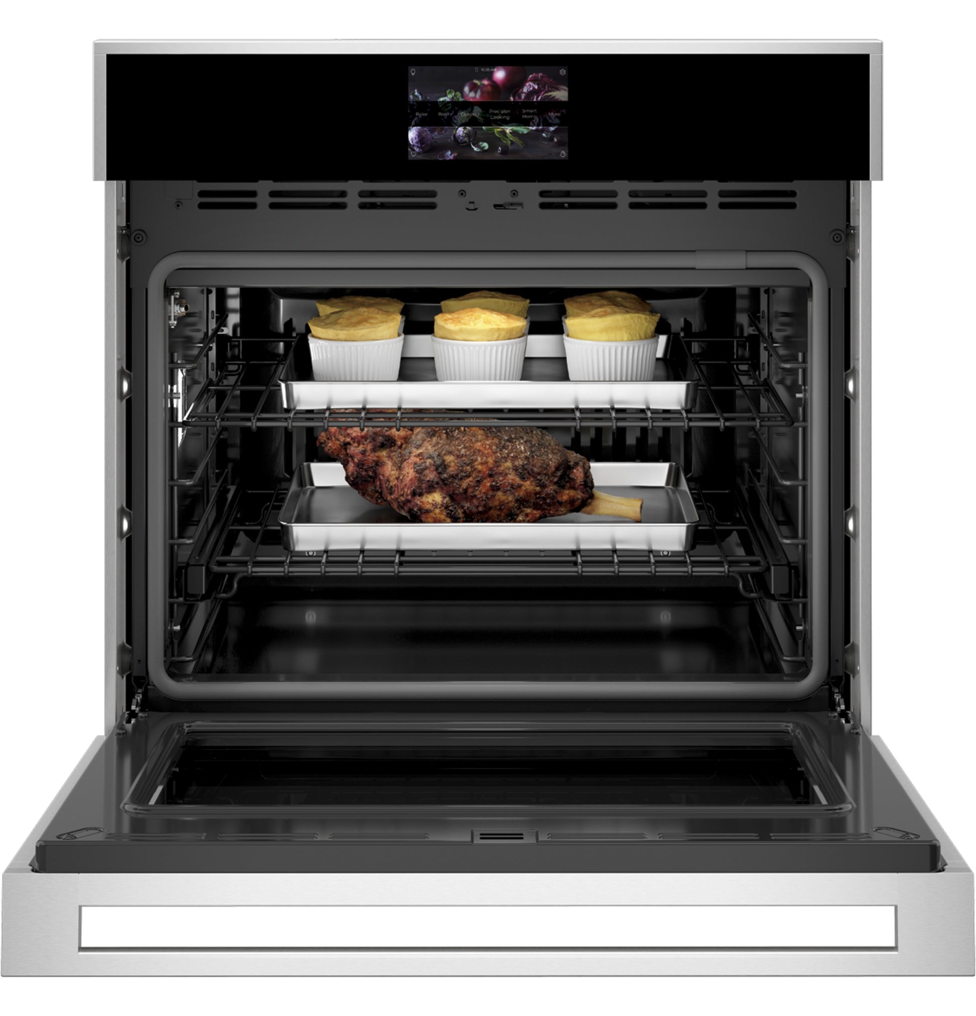 Open minimalist wall oven with stainless steel trim baking meat and soufflés inside in Appliances collection