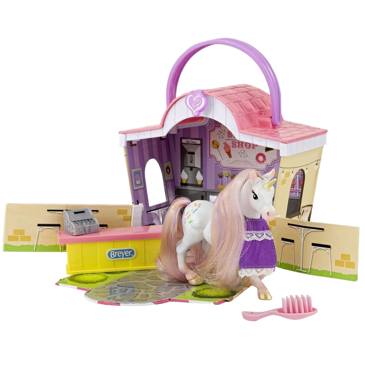 Pink and purple toy sweet shop playset with white unicorn figure wearing a purple dress and a hairbrush accessory