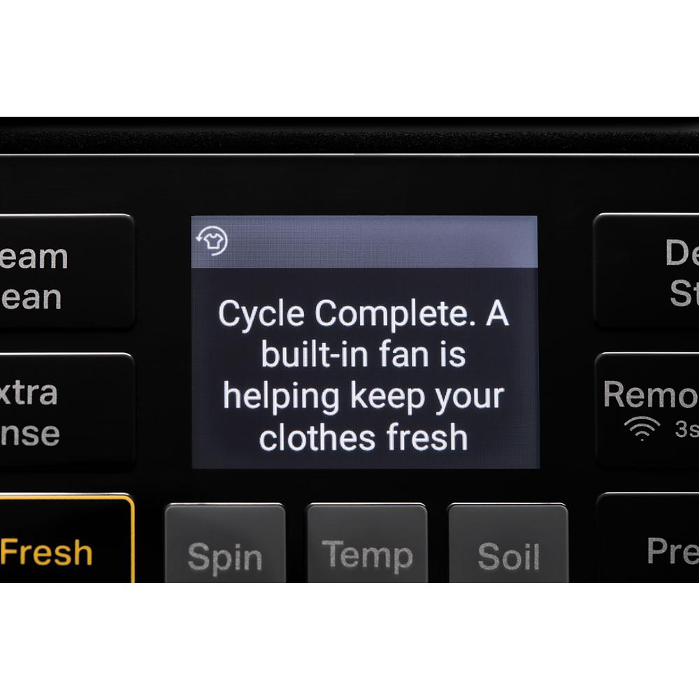 Close-up of smart washer digital display showing cycle complete message with fan feature to keep clothes fresh