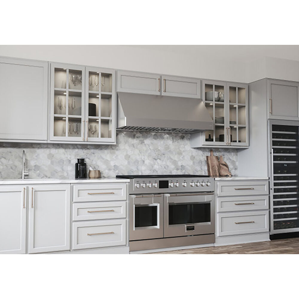 Stainless steel 30-inch canopy hood with seamless contours and six-speed controls in modern kitchen with white cabinets