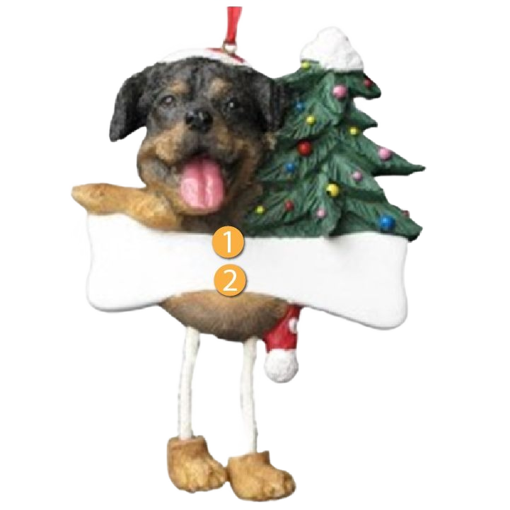 Playful Rottweiler ornament with dangling legs holding a Christmas tree and blank bone for holiday decoration.