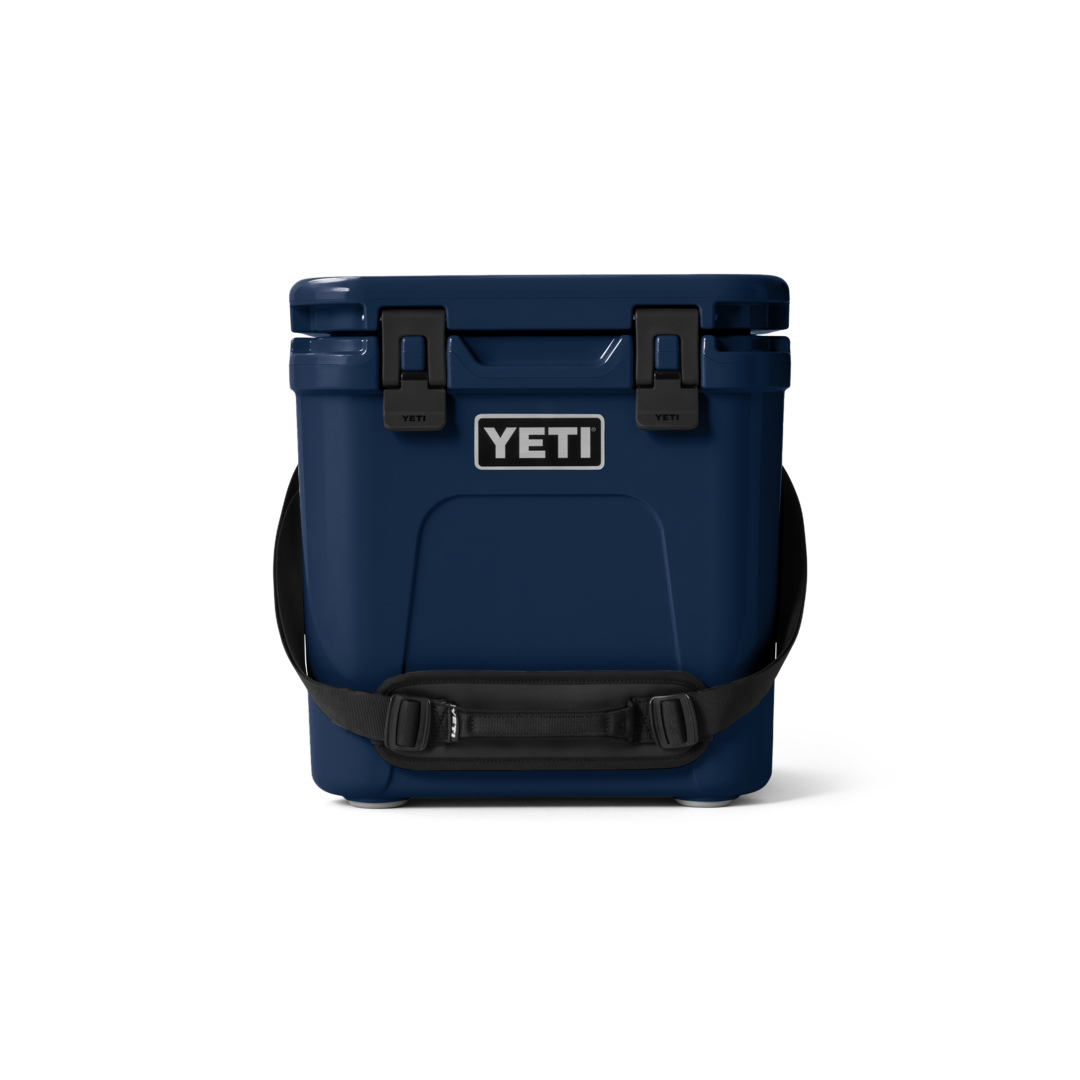 Dark blue hard cooler with secure latches and padded shoulder strap for food storage and organization collections