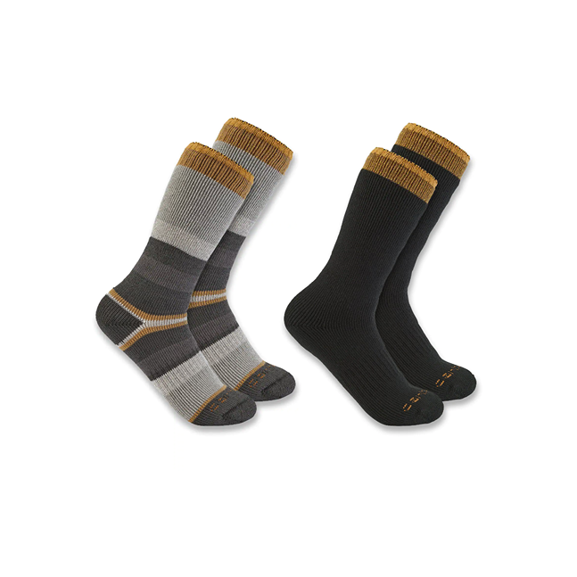 Two pairs of Carhartt crew socks in assorted gray tones and solid black with gold trim, extra-large size.
