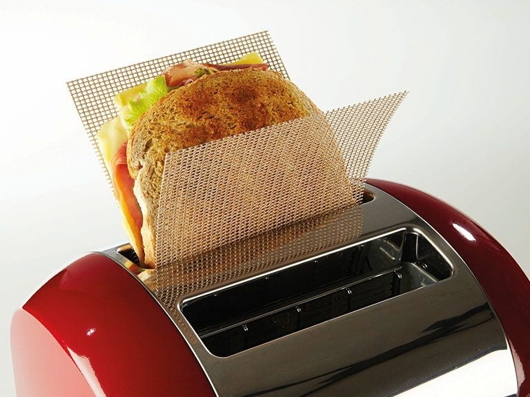 Two mesh toast bags holding sandwich bread in red toaster for kitchenware under $50 collection