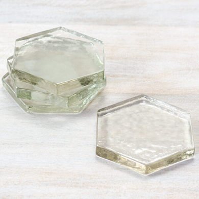Set of four clear glass hexagon coasters with textured surface for home improvement and garden use