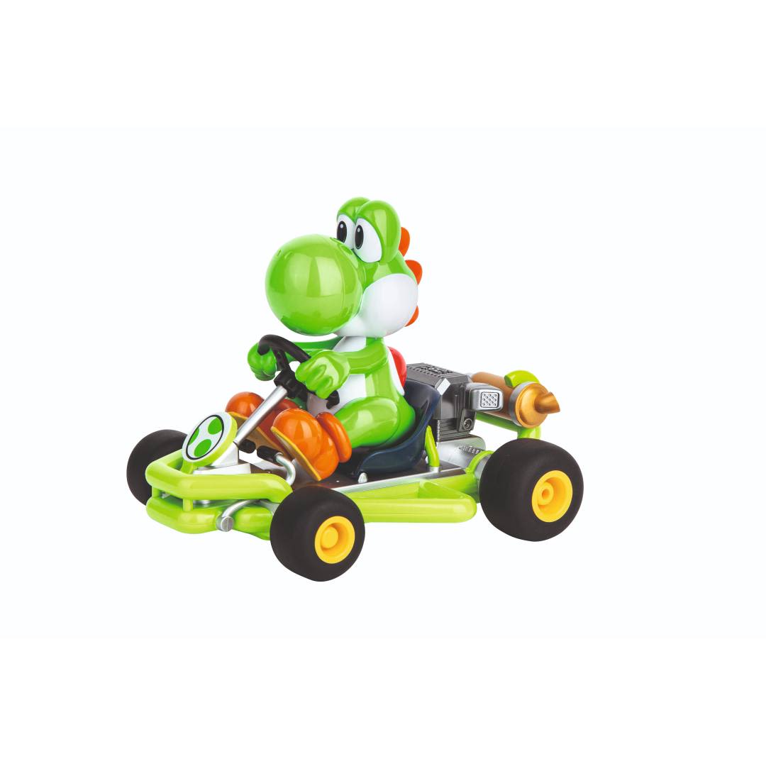 Green Yoshi character driving a detailed miniature Mario Kart pipe racer toy model with black tires and orange accents