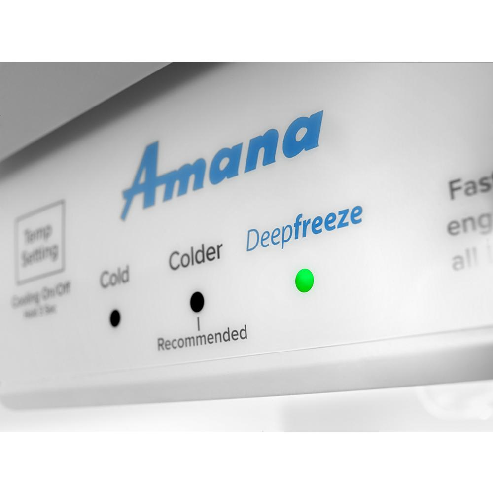 Close-up of freezer control panel with temperature settings and green indicator light in appliances and kitchenware collection