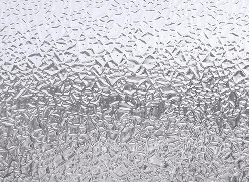 Textured translucent window film with a frosted glacier pattern for enhanced privacy in home improvement projects