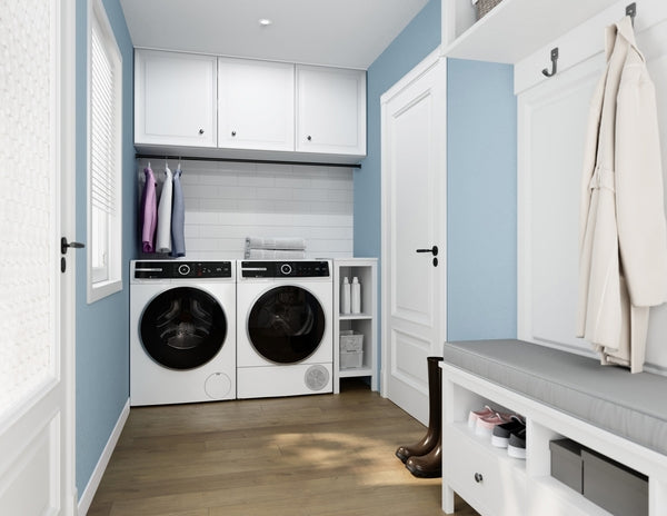 Laundry room with white compact washer and dryer set beside storage shelves and blue walls in home improvement setting