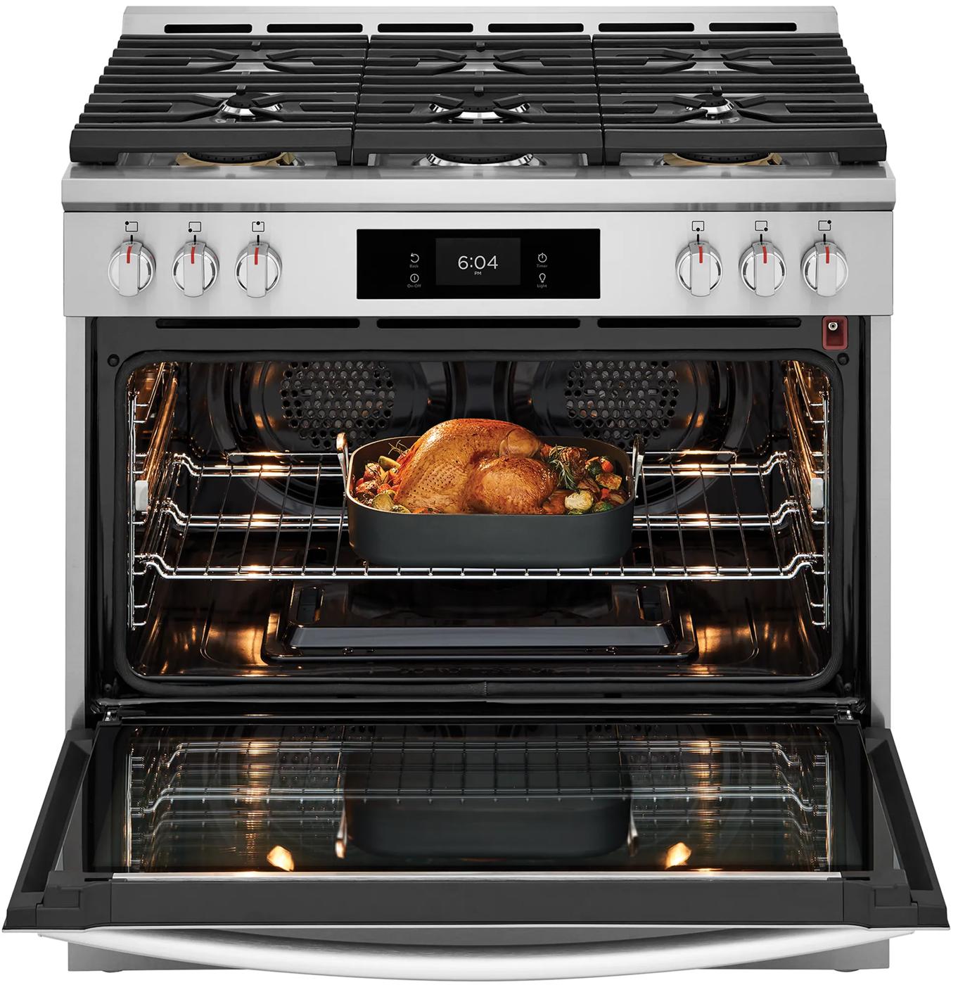 Stainless steel 36-inch gas range with six burners and roasted chicken cooking inside open oven door from kitchen appliances collection