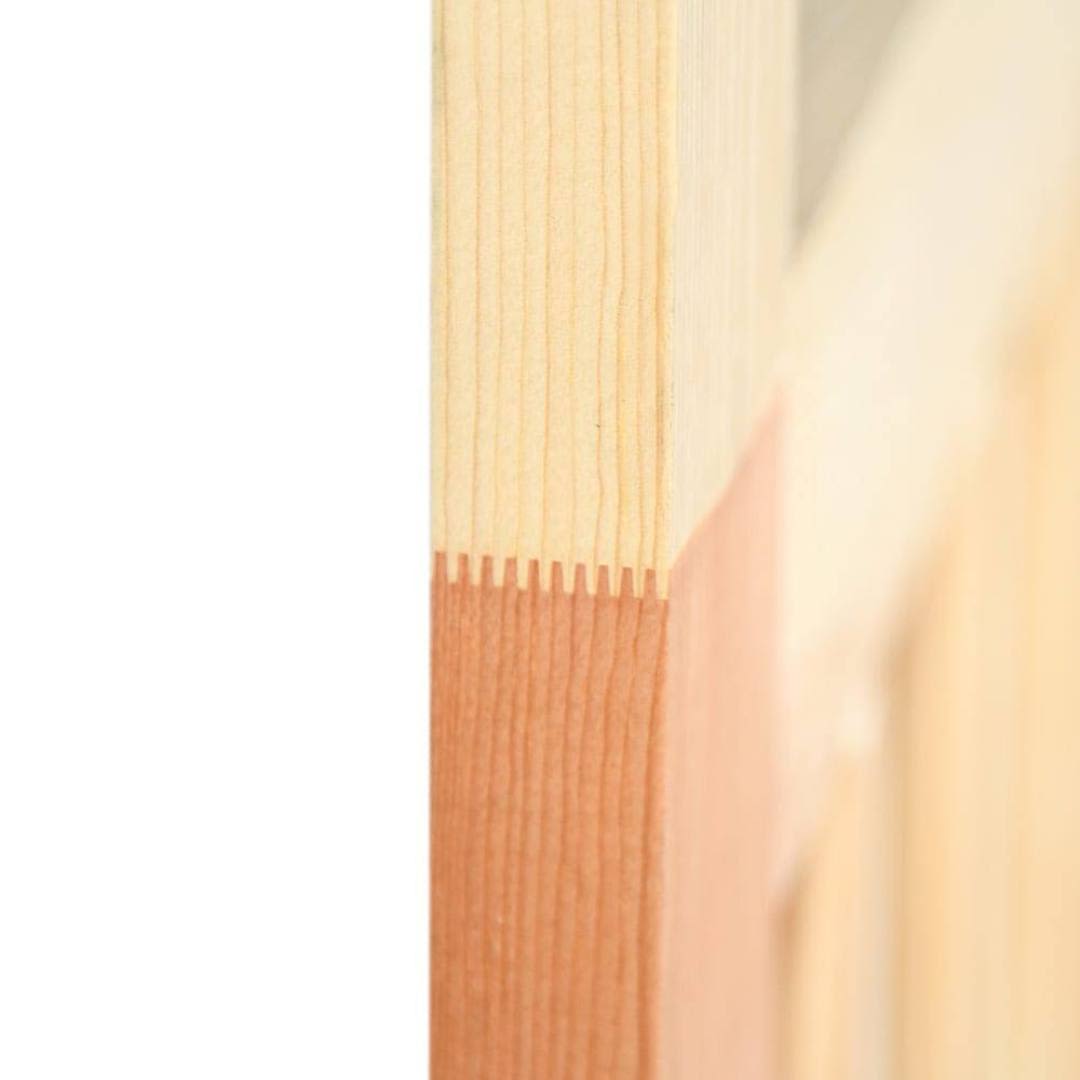 Close-up of interlocking wood joint detail on a natural wood T-bar screen door for home improvement projects