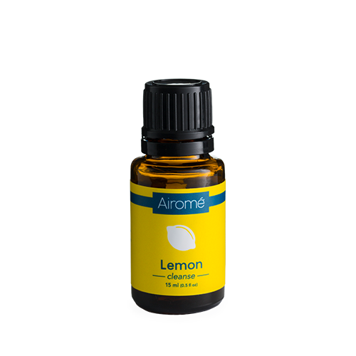 Amber glass bottle of lemon essential oil with blue and yellow label for home fragrance use