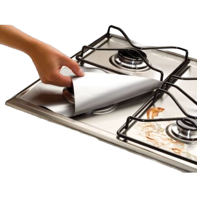 Hand placing a silver heat-resistant protector over a gas stove burner in kitchenware and under $50 collections
