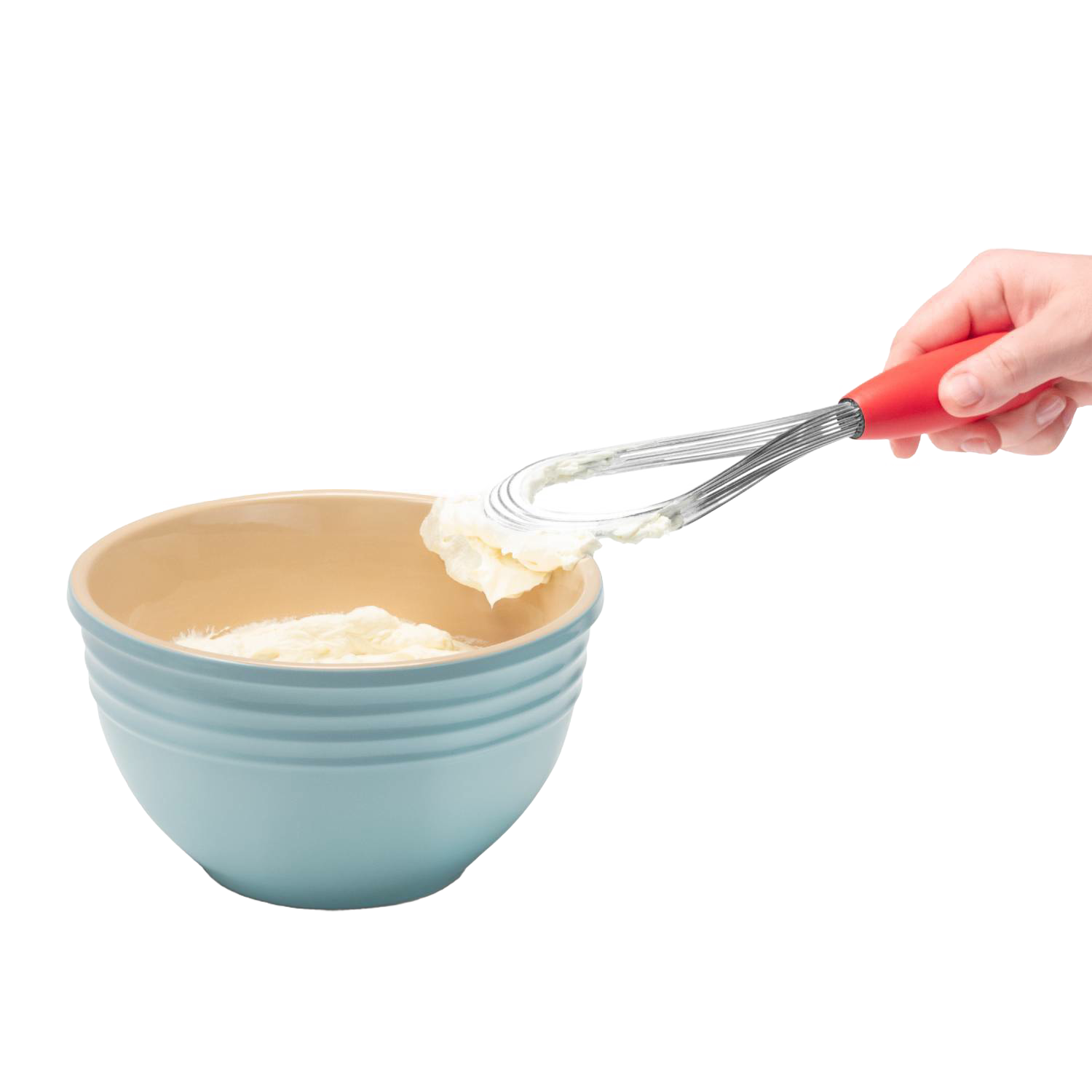 Hand holding red-handled stainless steel flisk lifting whipped cream from blue mixing bowl in kitchen utensils collection