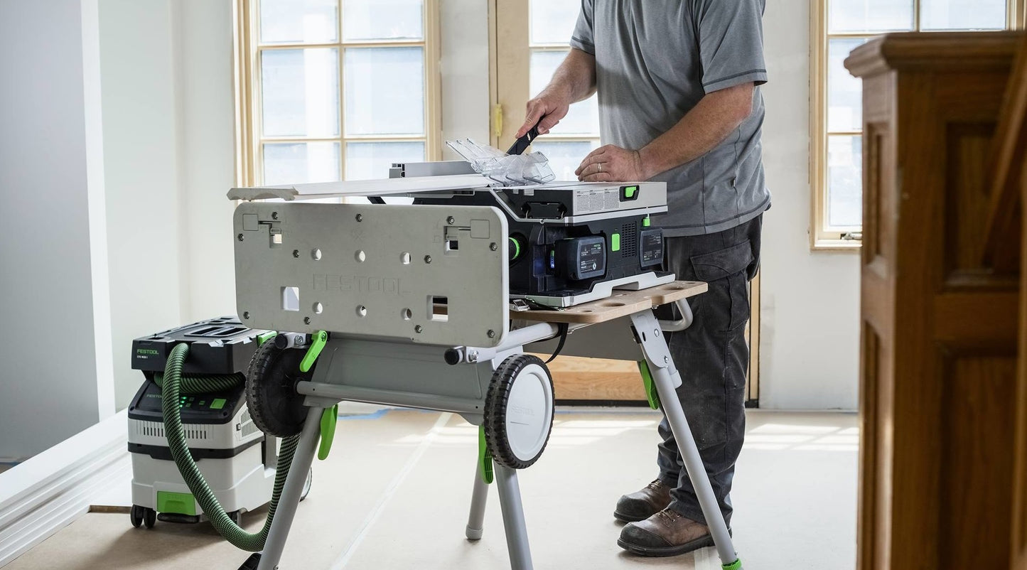 Cordless table saw setup on portable stand with dust extractor, part of electric power tools for home improvement.