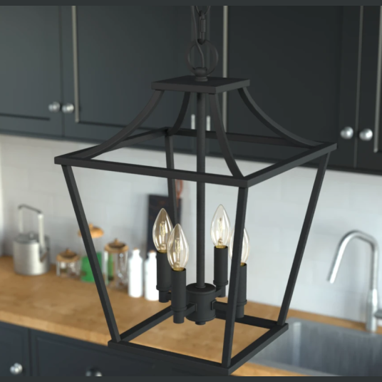 Natural iron 4-light lantern pendant above kitchen island with black cabinets and wooden countertop in modern kitchen setting