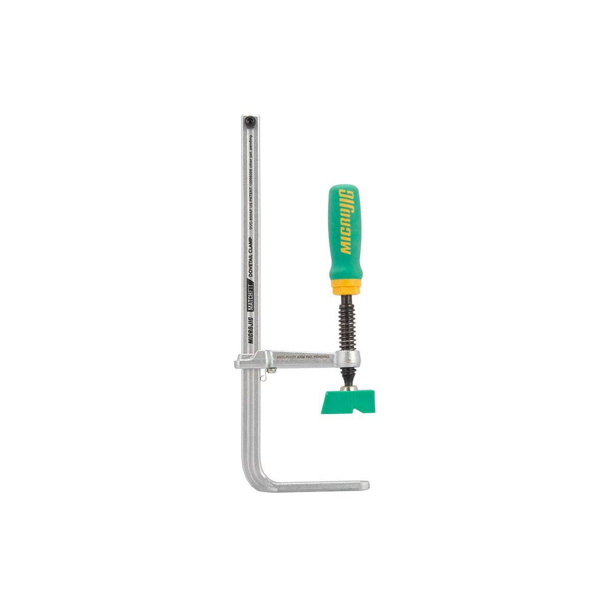 Adjustable steel dovetail track clamp with ergonomic green and yellow handle for precise woodworking and home improvement tasks