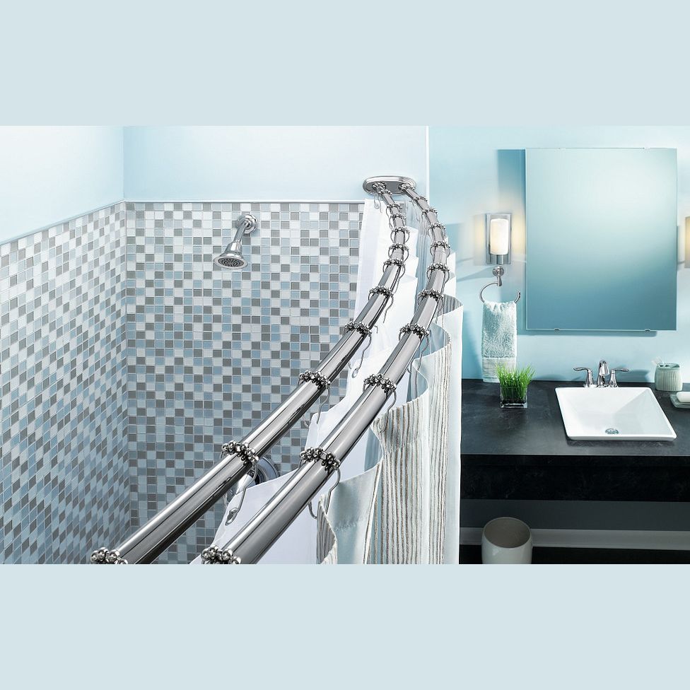 Chrome adjustable double curved shower rod installed above tiled shower area in modern bathroom setting