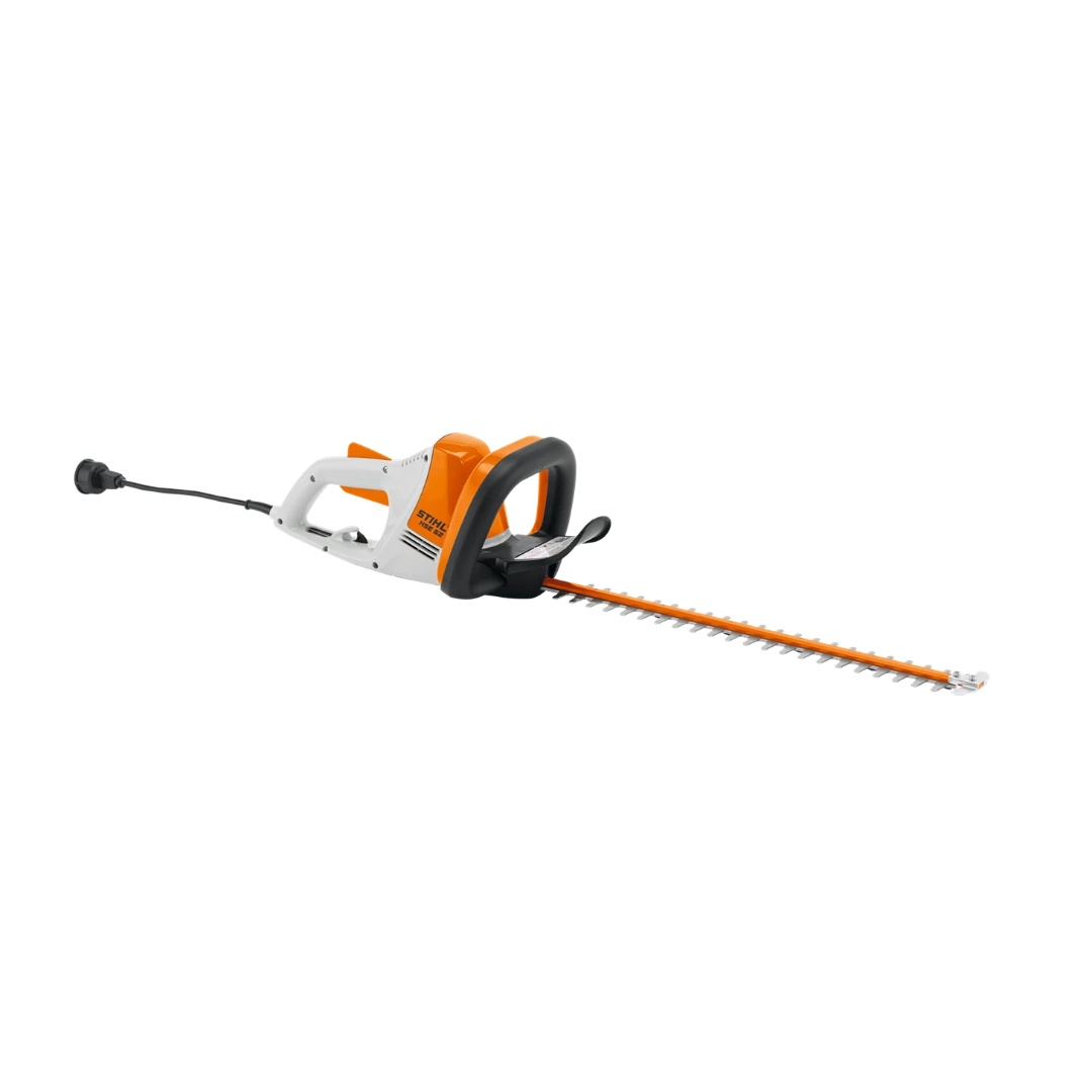 Compact electric hedge trimmer with orange and white body for precise trimming in tools and home improvement tasks