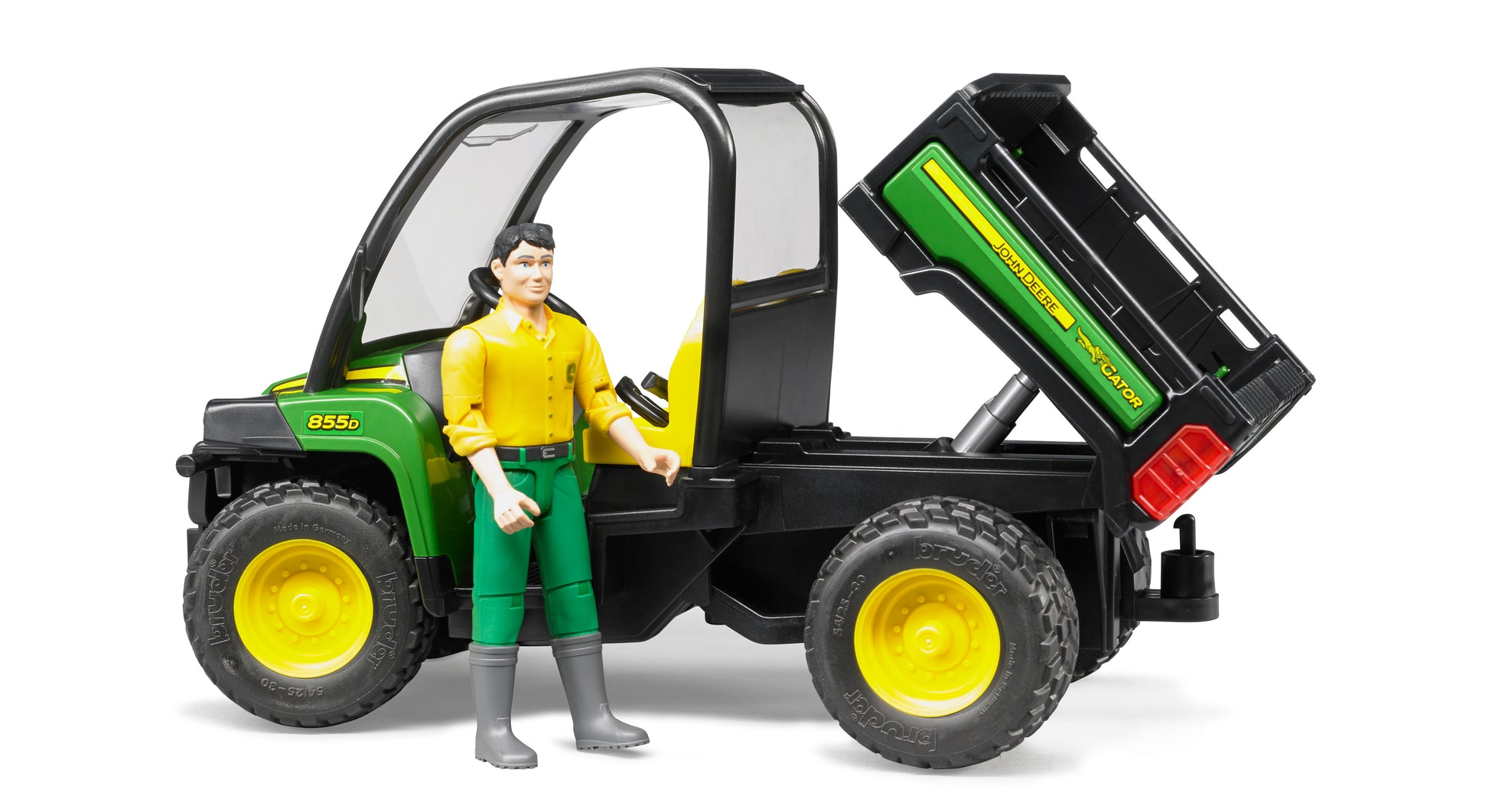 Green and yellow utility vehicle toy with tipping cargo bed and driver figure from Bruder Toys in Vehicles & Remote Controlled Toys collection