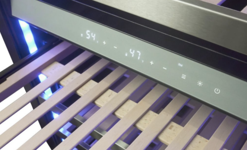 Close-up of digital temperature control panel and wooden shelves inside a stainless steel wine cooler in Appliances collection