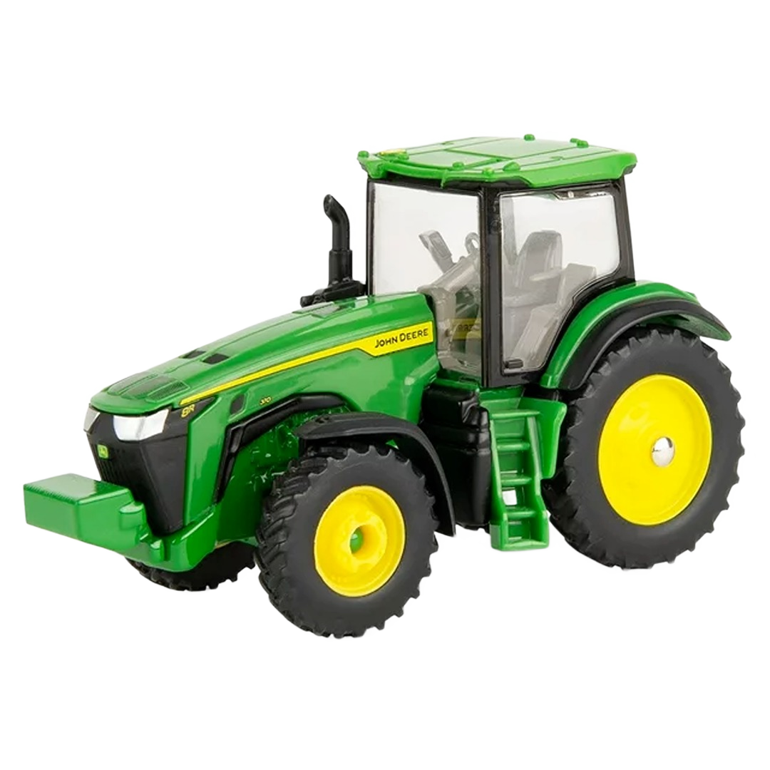 Green and yellow scale model tractor toy with detailed cab and large tires for collectible or display use