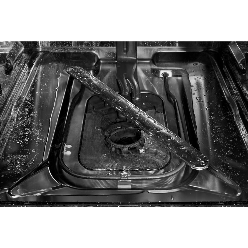 Close-up of stainless steel dishwasher bottom spray arm with water droplets highlighting durable wash system component